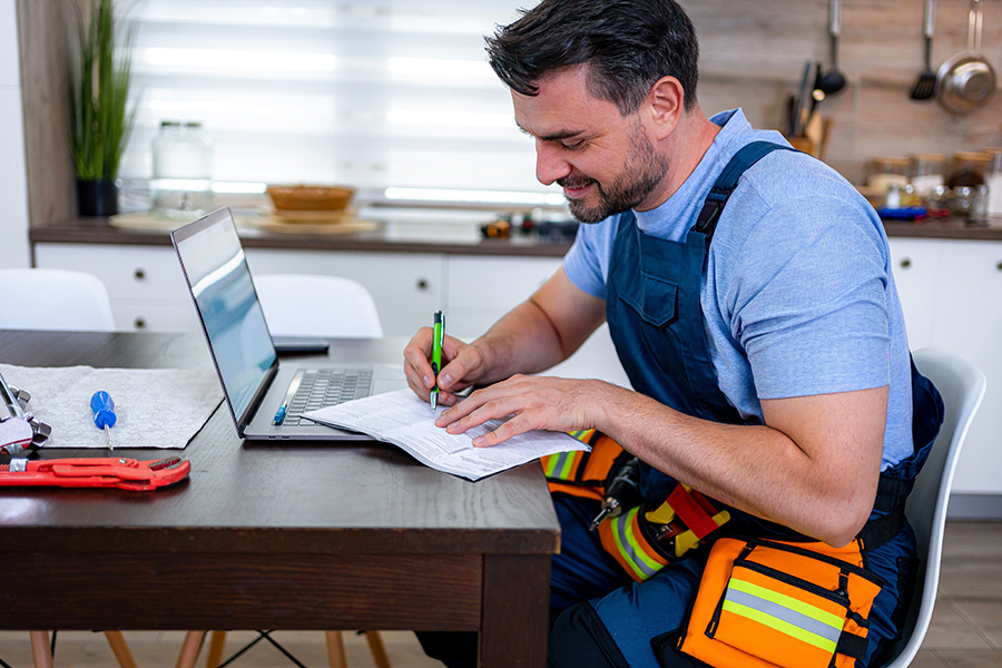 Tradie Business Bookkeeping - Tradie reviewing job costs and project expenses